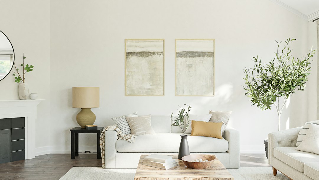 Bright living room with a sofa, fireplace and wood floors